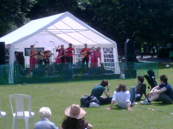 Band on stage under cover
